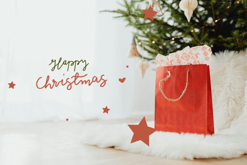 A cozy indoor Christmas scene featuring a festive gift bag by a decorated tree.